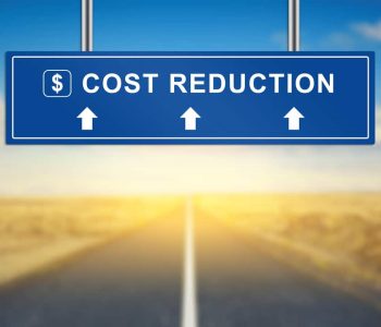 cost reduction words on blue road sign with blurred background